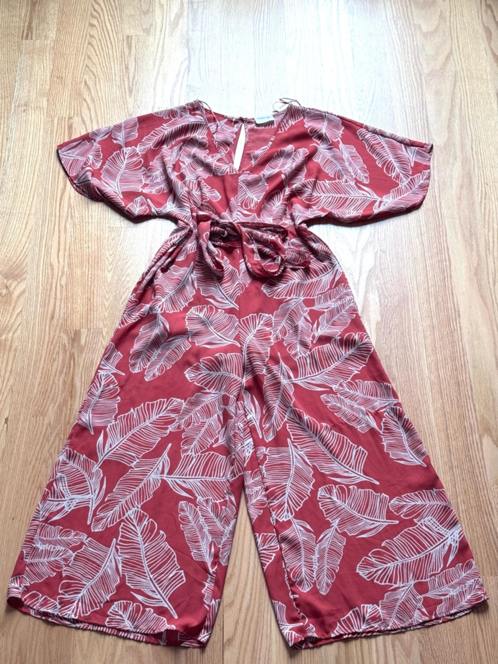 Sienna Sky size medium Orange/Red and Cream Floral Wrap jump suit